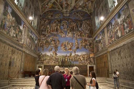 Group in front of Last Judgement in Sistine Chapel 