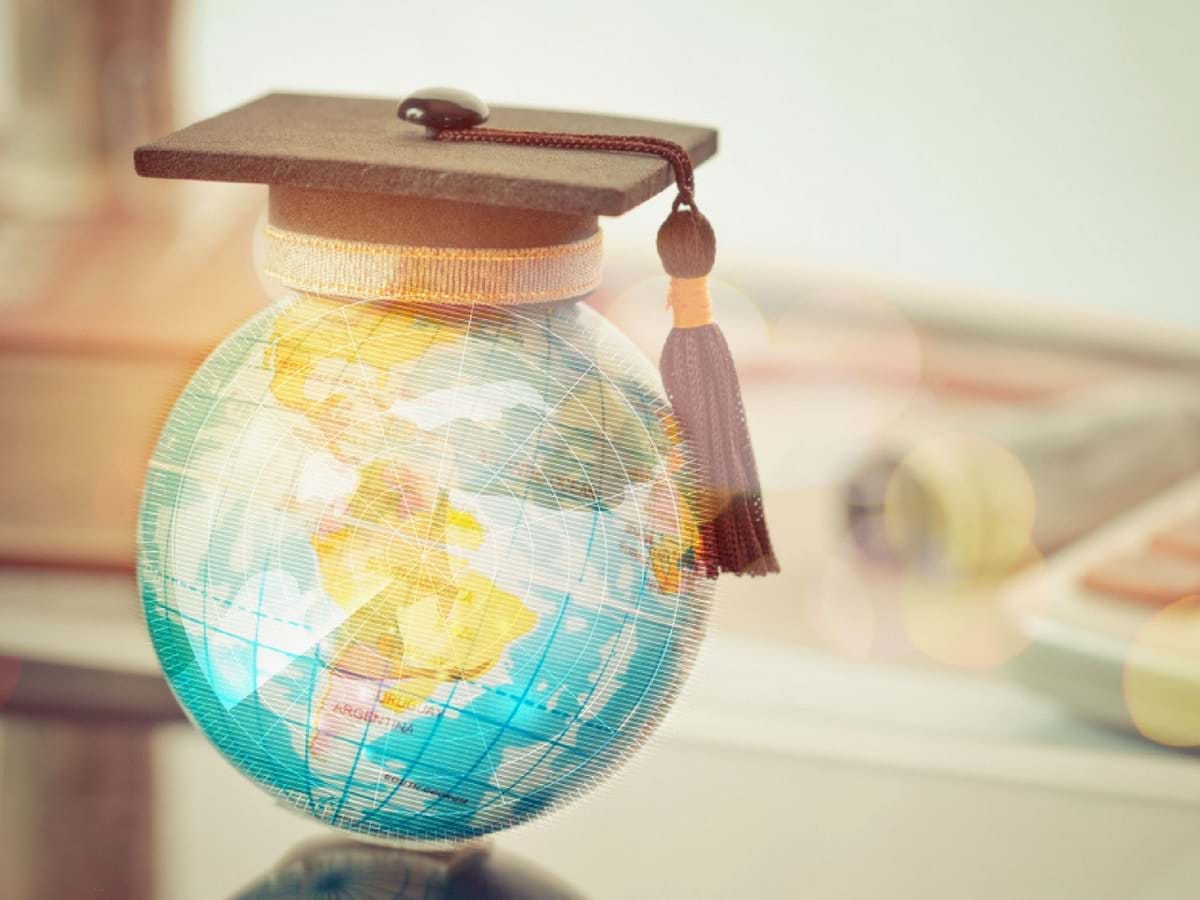 Globe with a graduation hat