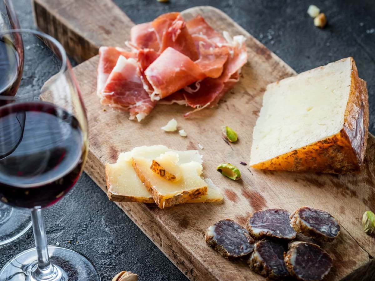 Wine, cheese & Spanish ham flatlay