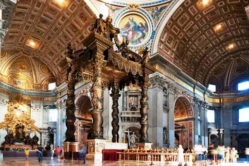 Tourists visiting the Altar inside St Peter Basilica