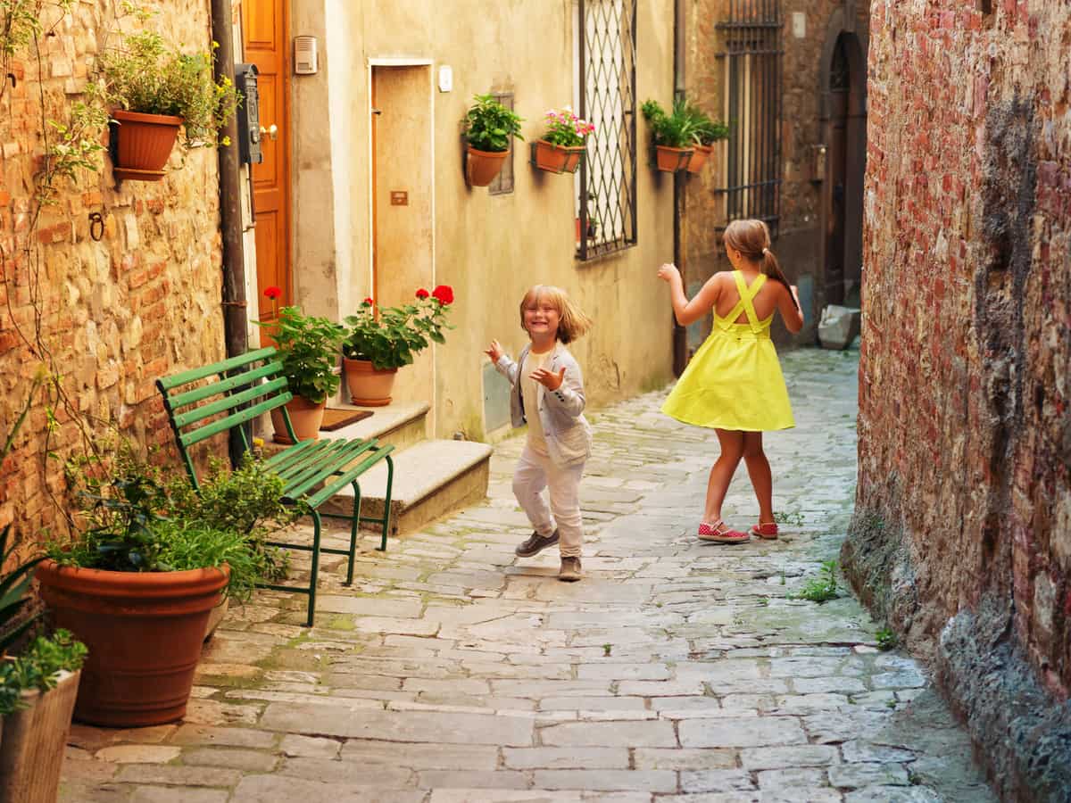 children playing in tuscan village