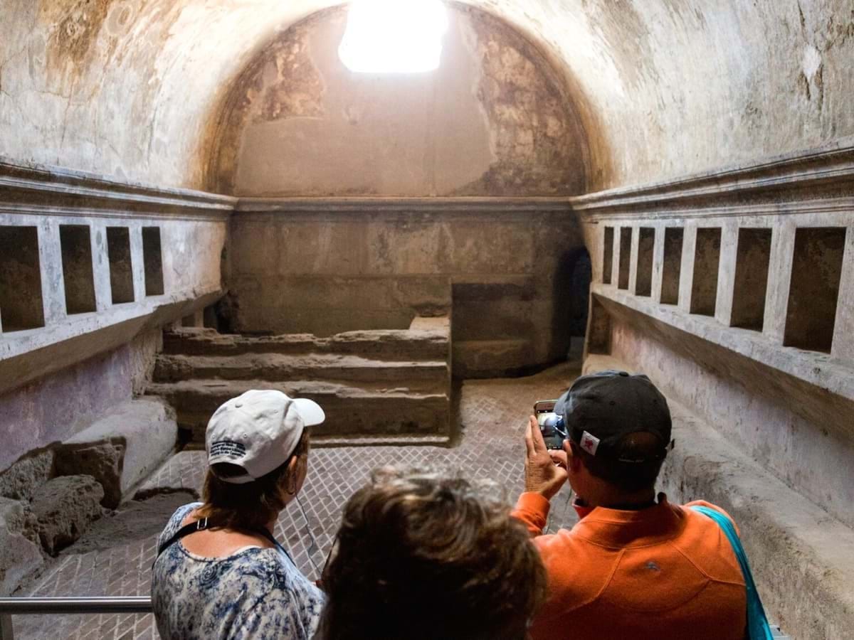 People visiting a Pompeii Thermal Bath