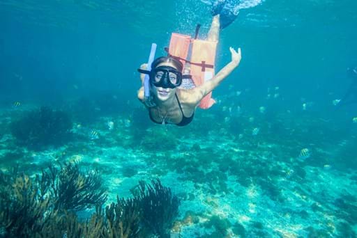 beautiful girl snorkeling in Isla Mujeres