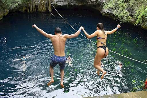 Couple-Dive into a Cenote