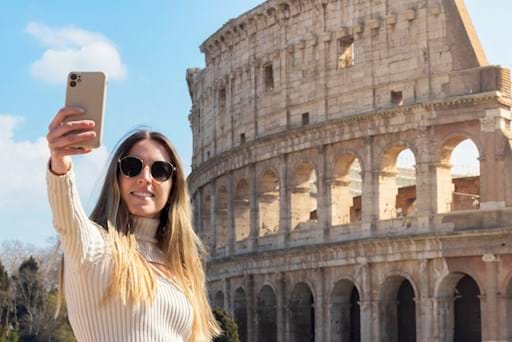 Girl taking a selfie at the Colosseum